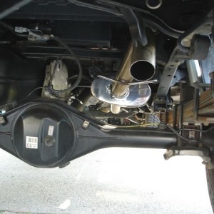 Dumped exhaust behind the axle