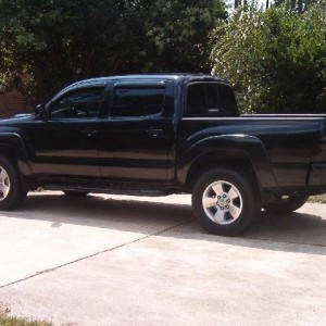 Cut mudflaps, darkened tails, debadged, tinted windows, stepbars...ummm...w