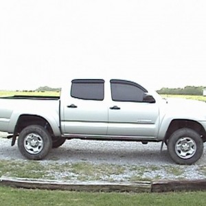 Lifted with factory Rims and Tires.