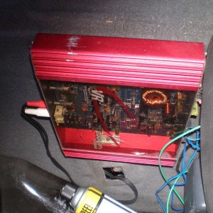 amp mounted behind seat