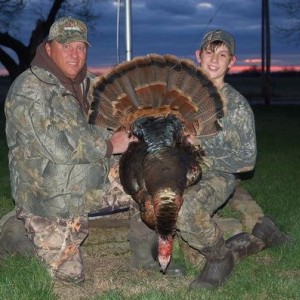 the owner of the camp and me with my turkey