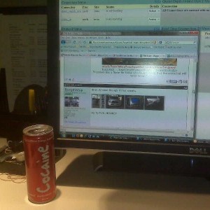 My desk at work. Cocaine energy drink at the ready. Checking this tw live o