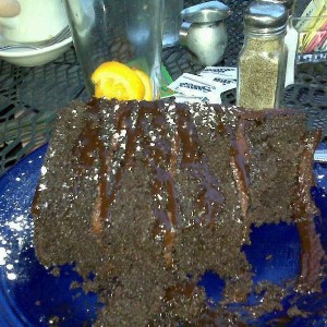 4inches high & as wide as a dinner plate. 4 layer chocolate cake. WOW!