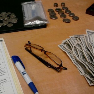 who pays for glasses in quarters and ones...?