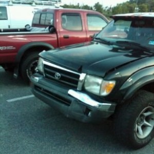 Poor banged up Taco I parked next to at Lowes.