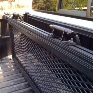 Mountain bike carrier mounted on cargo divider