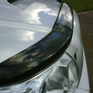 Clear laminate on deflector started to web.