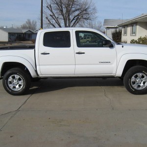 Pretty stock. 2" lift up front, TSB rear