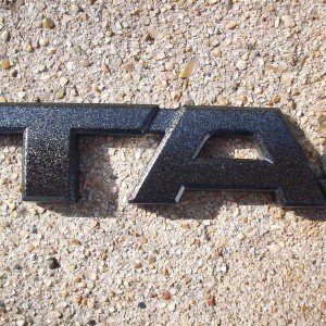 Emblem Speckled Black Closeup