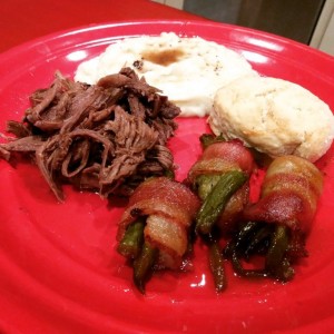 Shoulder roast and gravy mashed taters and candied bacon wrapped green beans and biscuits