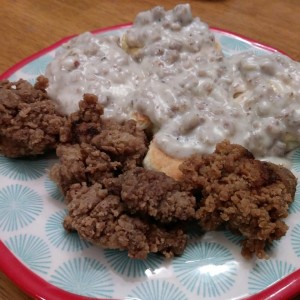 Chicken livers and gravy and biscuit