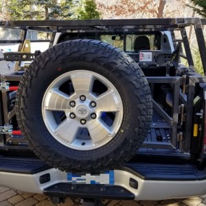 12-17-bed-rack-swingtail-tire-mounted-Tacoma-1