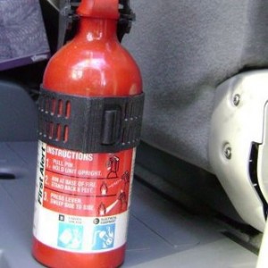 Fire extinguisher in access cab AC rear door