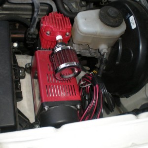 air compressor mounted under hood
