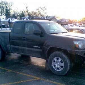 Winter wheels and tires in salty parking lot