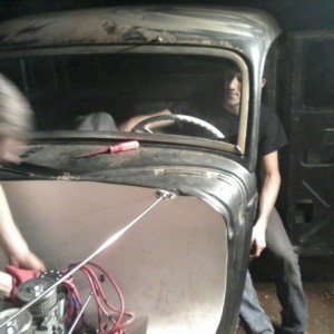 me and my buddy putting final touches on hot rod