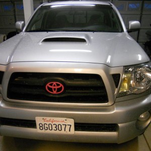Pink painted toyota grille emblem