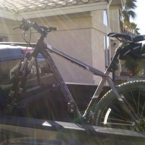 Bike clears the garage just fine when stowed in bed.