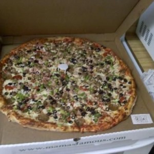 family size pizza. Huge. Cheese packet for comparison.