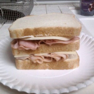 Turkey ham swiss provolone american with mayo honey mustard and a little of