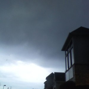 black sky. super low clouds... humid.. i think its gonna rain.
