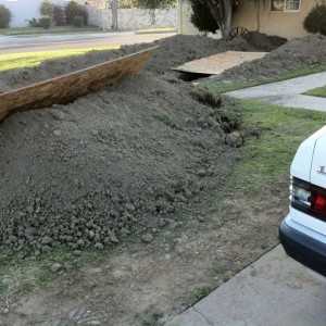 Building some sweet dirtbike jumps on the front yard!
