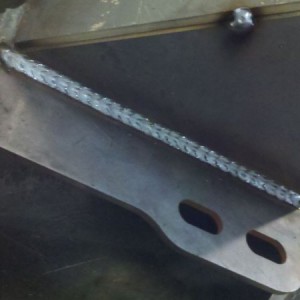 Layin down some nice beads on littledvl's bumper.
