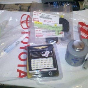 Got some goodies today: spark plugs, anti seize, cup holder tabs, touch up 