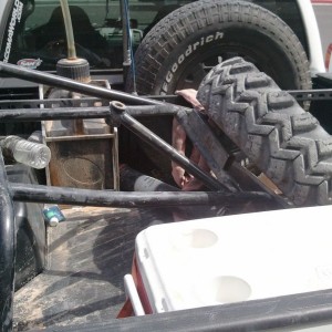 Parts I retrieved. Engine cage/tire carrier, tire, spare driveline.