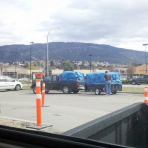 Some guy doin work in the tim hortons parking lot