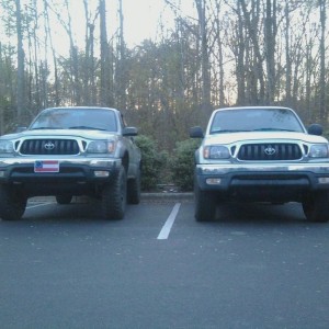 My lifted truck next to my buddies stock truck.