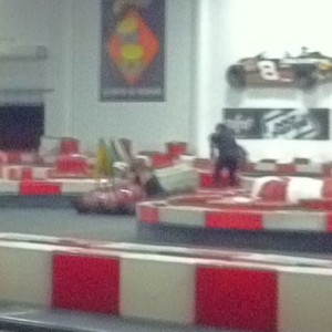 Chick slammed straight into the wall and got her cart stuck underneath. She