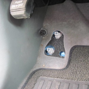 08-Remove rubber gromet next to kick panel