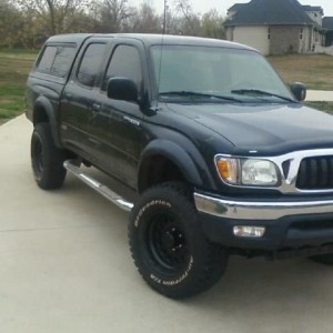 Painted my rims. My front bumper is bed linered, but i took this picture be
