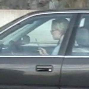 that is a toothbrush in her hands, and yes she was brushing her teeth while