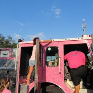 Signing Mom's name on Pink Fire Truck