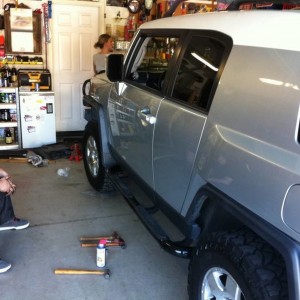 Kevin (pictured), Curt and I (under truck) installing lift.