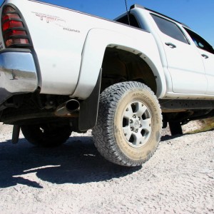 Flex with a tire off the ground...