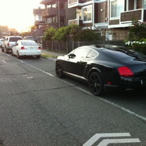 A murdered out Bentley Continental GT parked just down from my truck tonigh