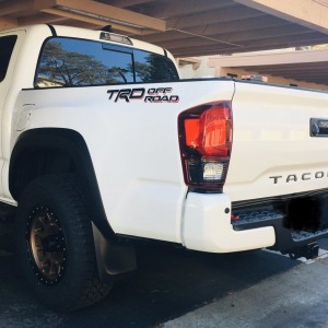 Black Tacoma Tailgate raised lettering
