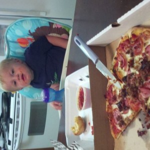 Me and my son eating on pizza and chesse bread nom nom nom nom nom Tight li