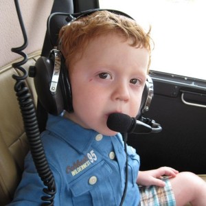 Little man's first helicopter ride.