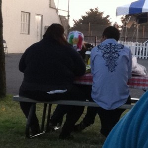 At the fair. b!&$? has tp hanging out her ass!!!