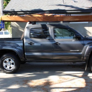 kayak resting on roof rack and roller