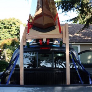back end of kayak strapped to loader/support