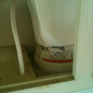 Someone decided to use a bucket to vent their range hood.......wtf?