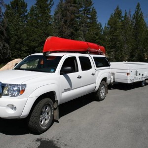 white taco with trailer and canoe