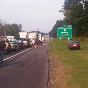 Roadside hangout... There is a overturned bus and two cars involved with se