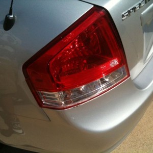 Cracked her taillight and bent the metal around the light