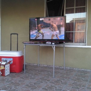Flat screen on the porch. Camping chairs on the lawn. Lifes good.